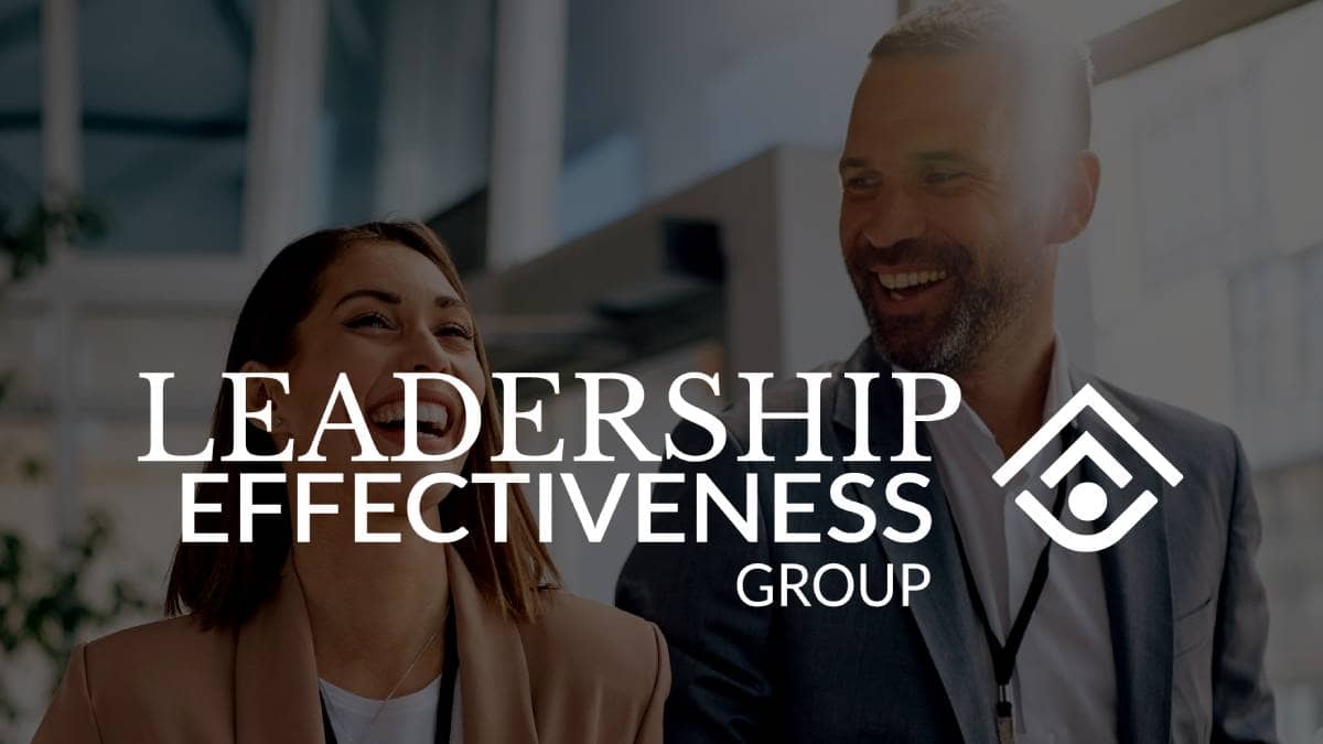 Leadership Effectiveness Group logo overlaid on a business man and woman